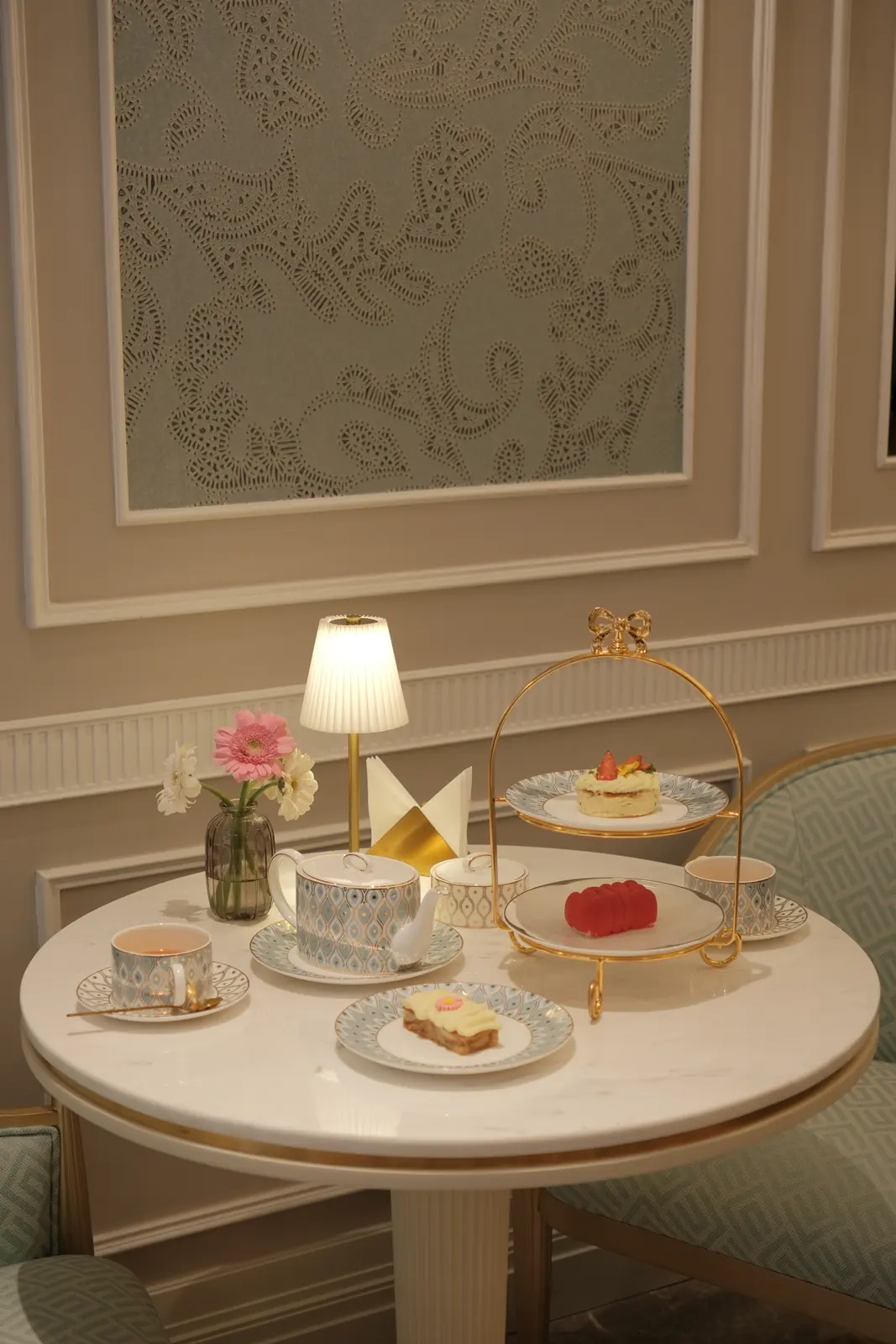 Afternoon tea table with a two-tier stand, teapot and flowers — Crema Pastry · Classyc Hàng Buồm