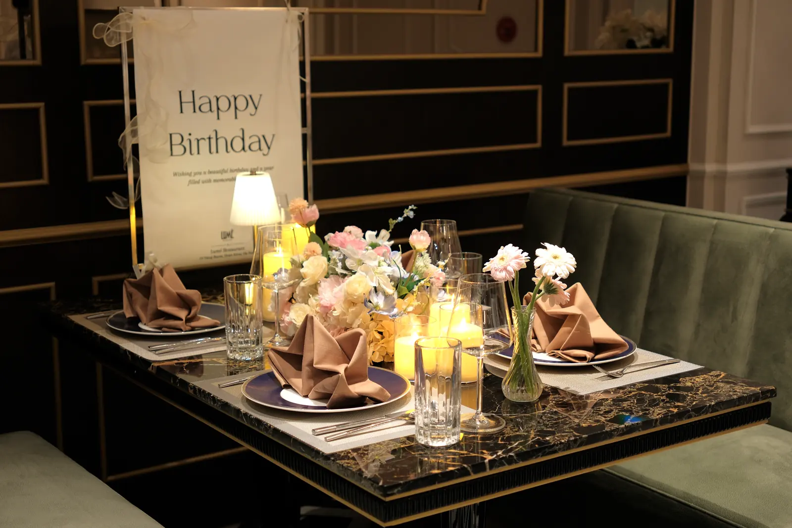 Birthday table with a pastel bouquet and candles — Lumé Restaurant · Classyc Hàng Buồm