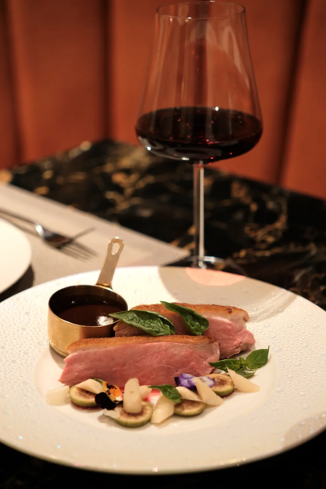 Sliced poultry with figs and a glass of red wine — Lumé Restaurant · Classyc Hàng Buồm