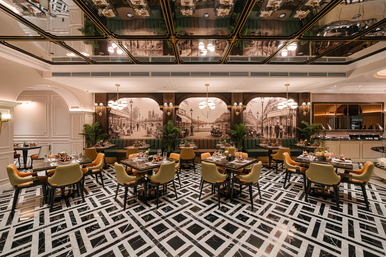 Dining room with green banquettes and set marble tables — Lumé Restaurant · Classyc Hàng Buồm
